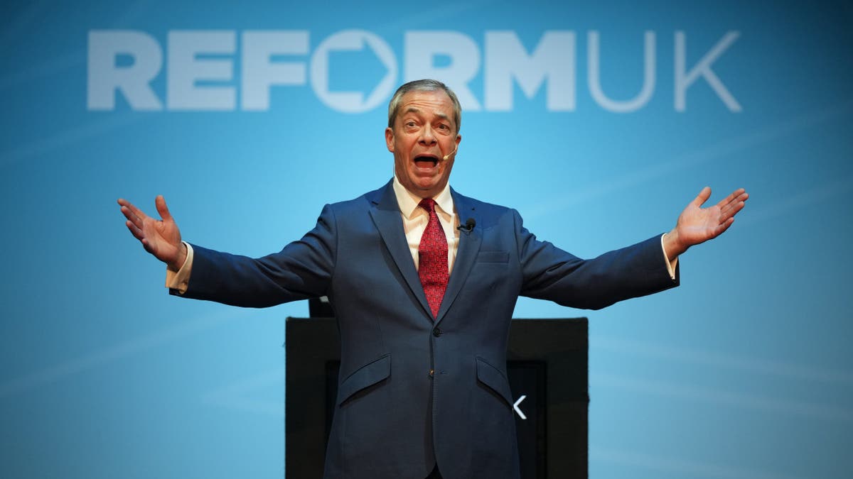 Nigel Farage, speaking in front of UK reform