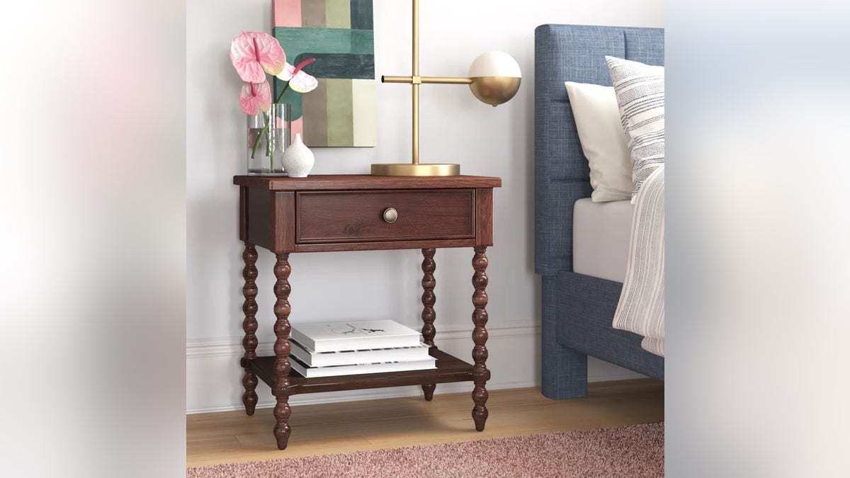 This nightstand has elegant spindle legs.