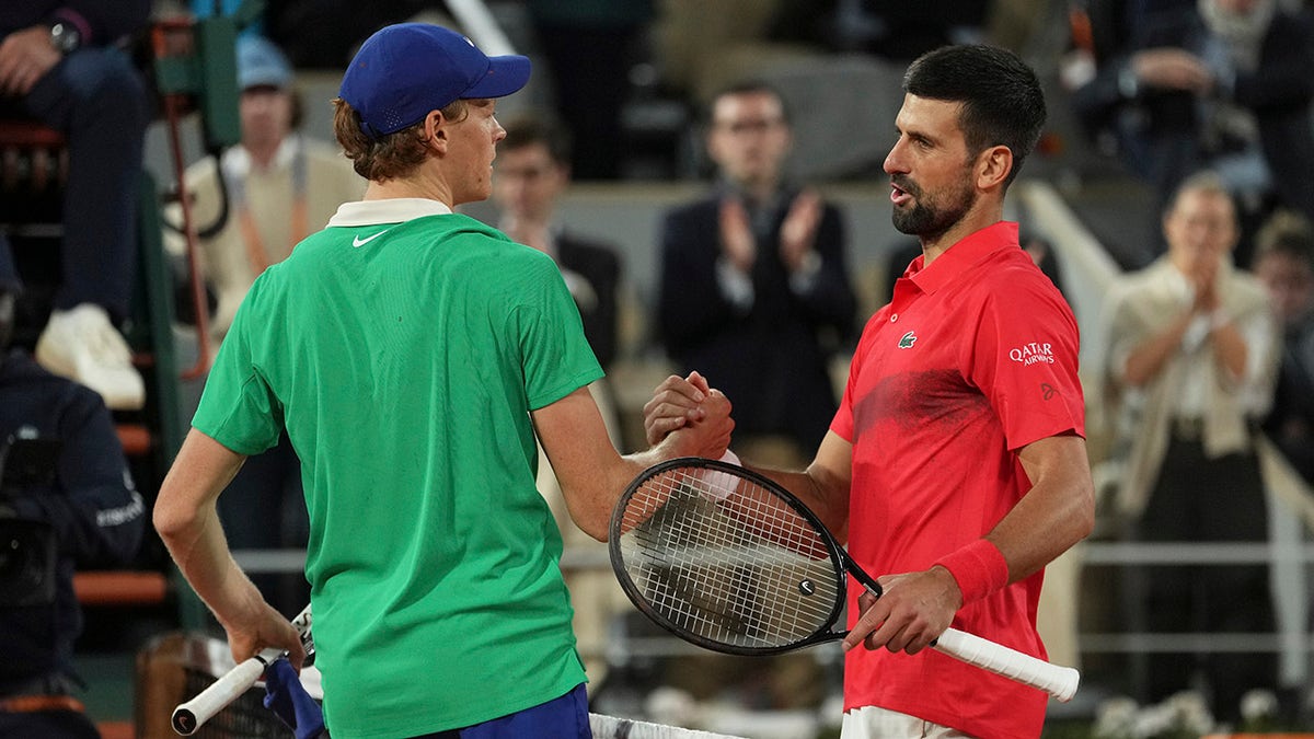 Jannik Sinner and Novak Djokovic shake hands