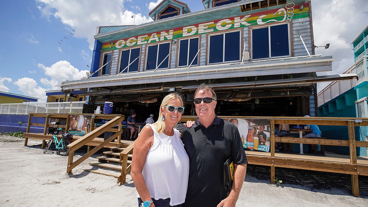 A pistillate   and antheral   wearing sunglasses airs  extracurricular  the Ocean Deck Restaurant & Beach Club successful  Daytona Beach, Florida.