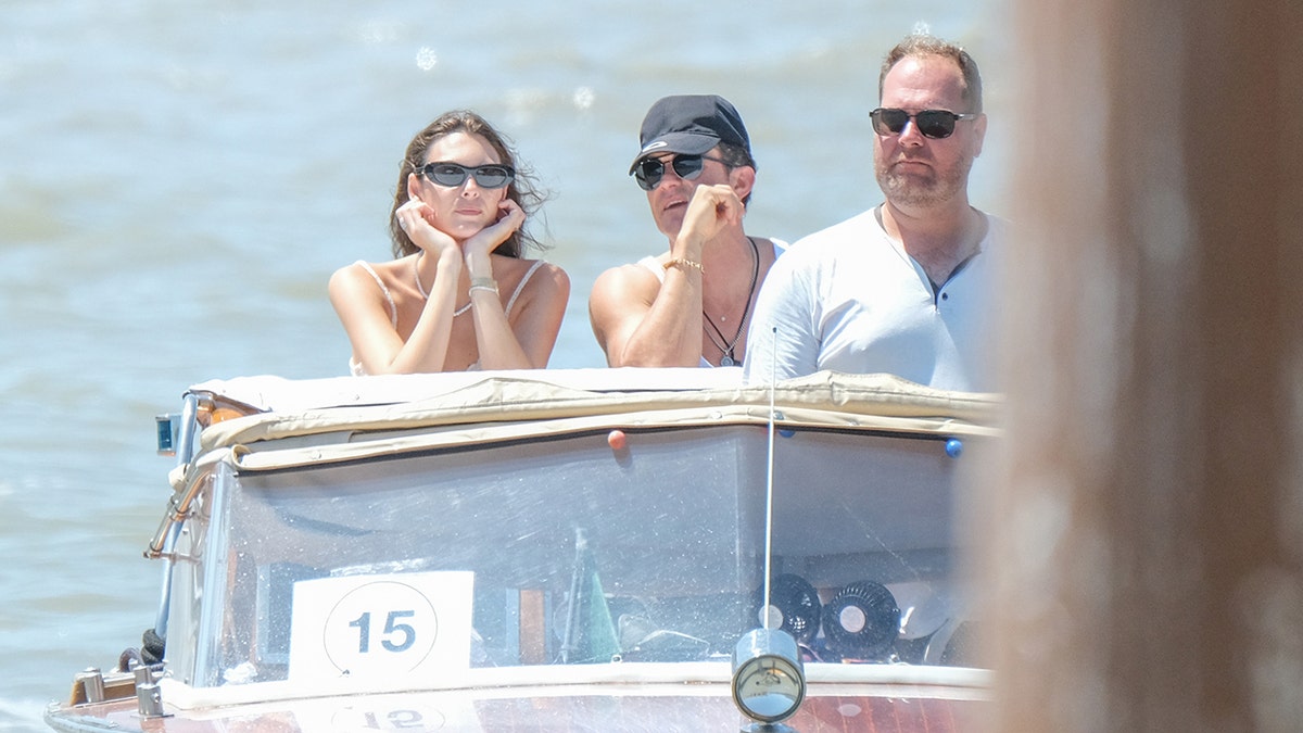 Vittoria Ceretti and Orlando Bloom leave Venice by water taxi.