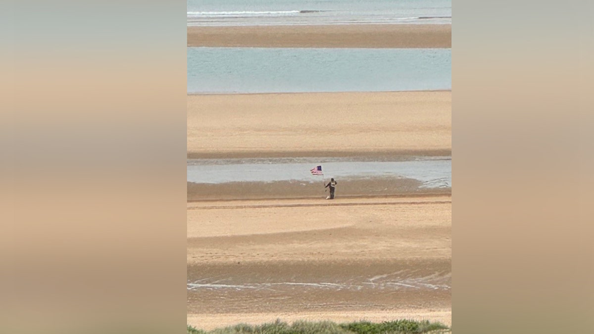 A seasoned stands connected the shores of Omaha Beach