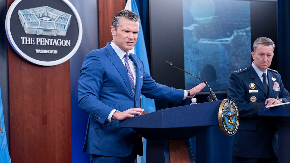 U.S. Defense Secretary Pete Hegseth and Chairman of the Joint Chiefs of Staff Air Force General Dan Caine speak at a Pentagon briefing