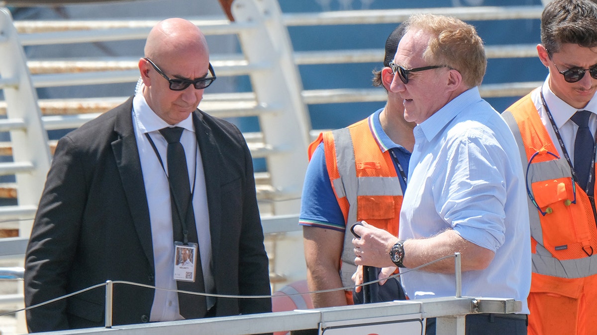 François Henri Pinault wears blue shirt and sunglasses