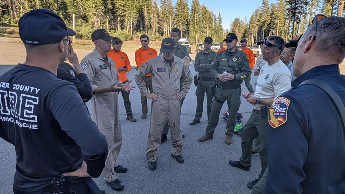 Law enforcement officials gather during a rescue operation.
