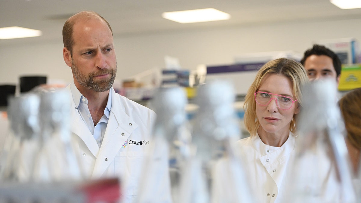 Prince William and Cate Blanchett in a white lab coat.