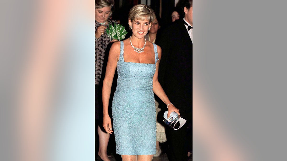 Princess Diana wearing a powder blue strappy dress with diamonds and pearls.