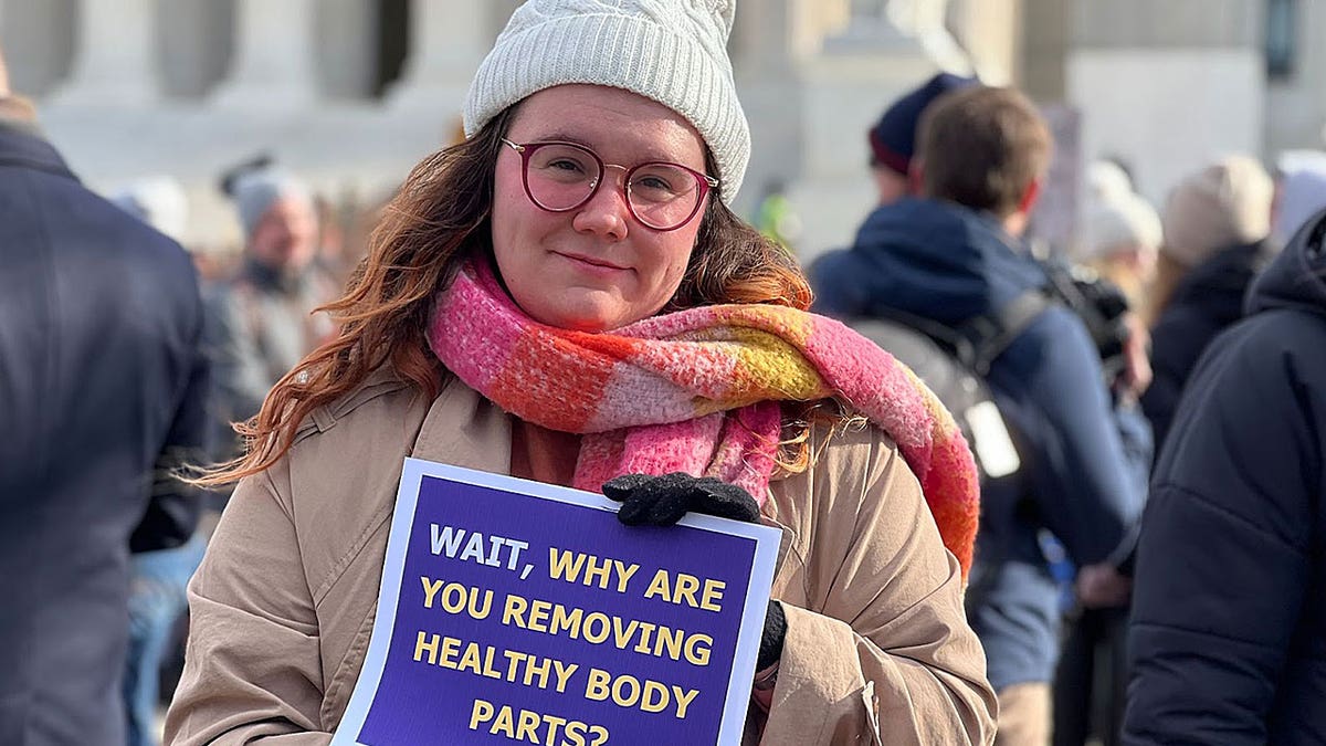 Prisha Mosley holding sign outside Supreme Court