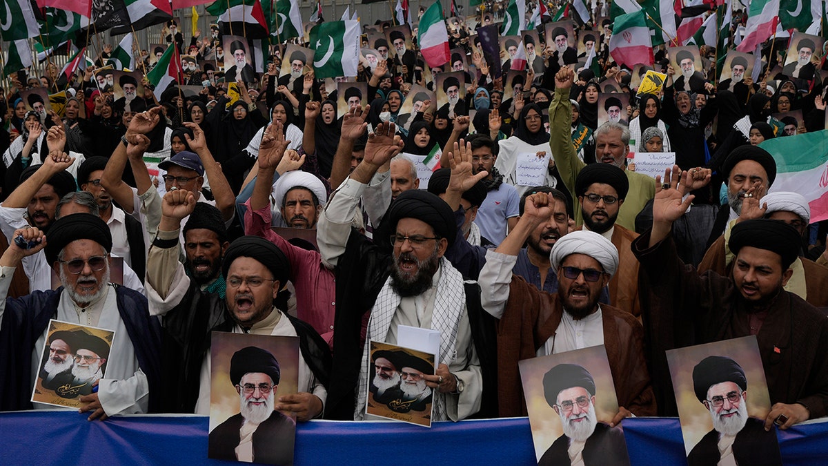 Iran flags and posters of the Ayatollah at a Pakistan demonstration