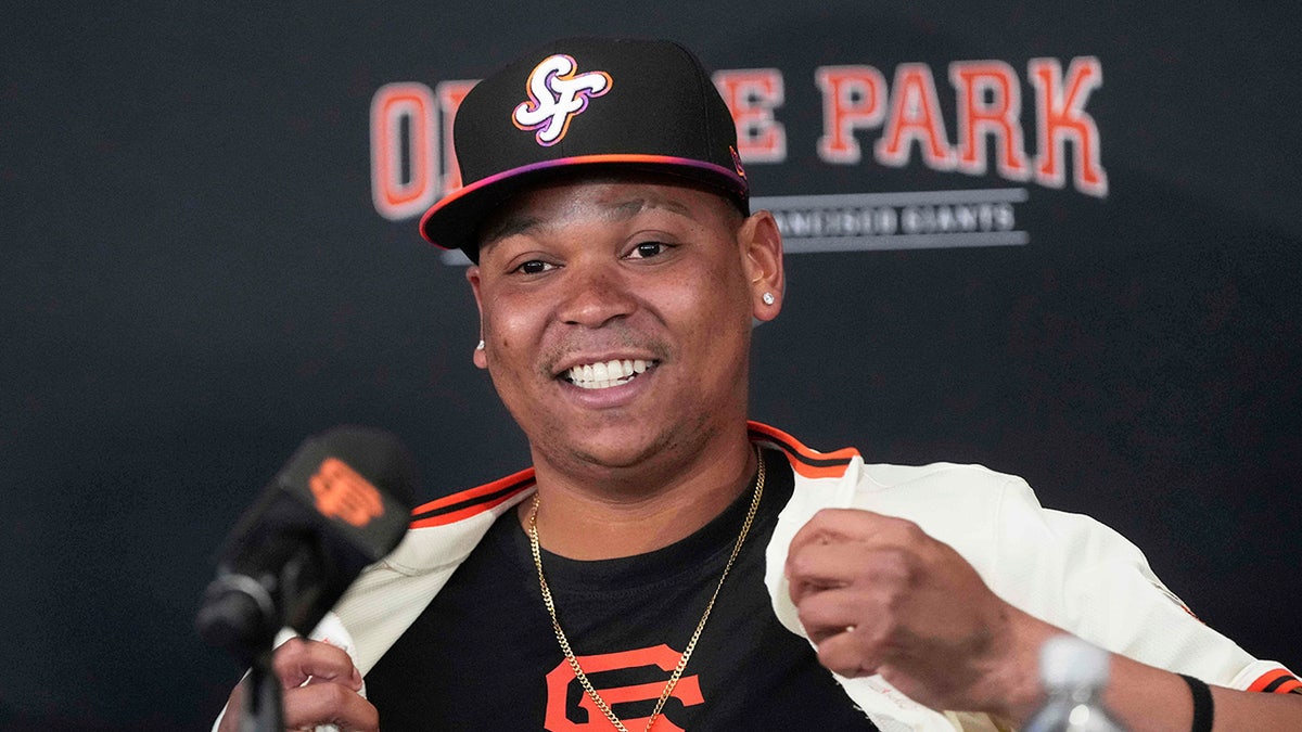Rafael Devers joins Giants, willing to play anywhere after Red Sox trade 3 Rafael Devers smiles with Giants jersey