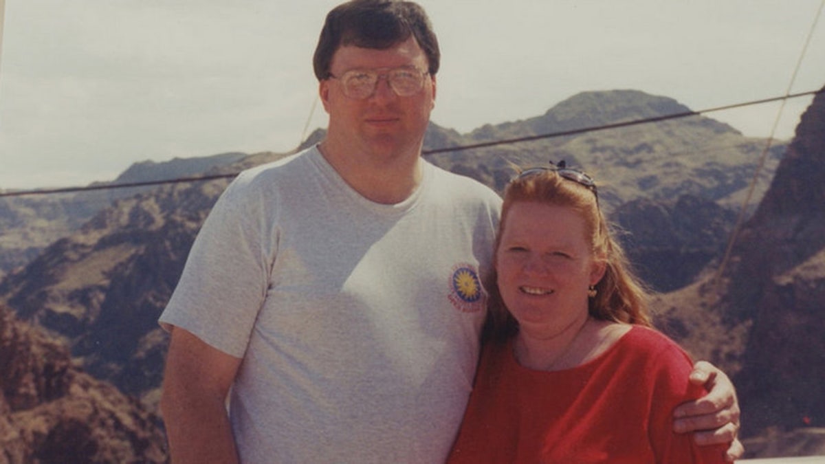 Rex Heuermann with his arm around Asa Ellerup outdoors.