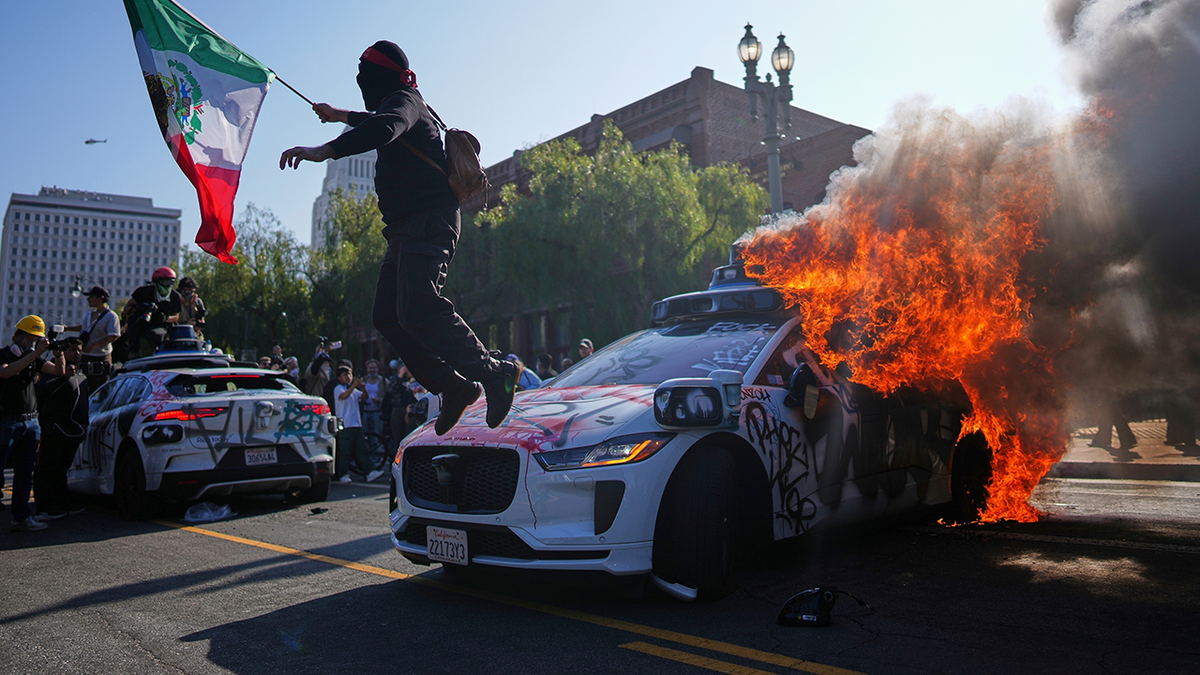 LA riot police car on fire