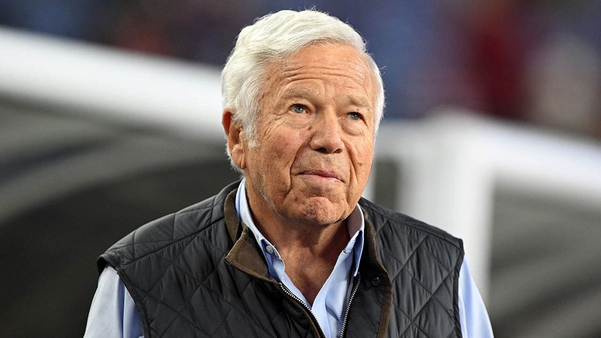 Robert Kraft looks on