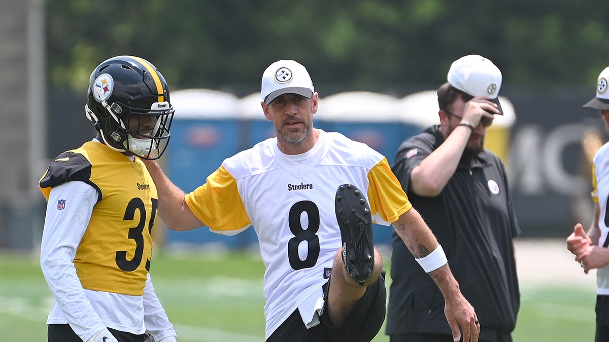 Aaron Rodgers stretching