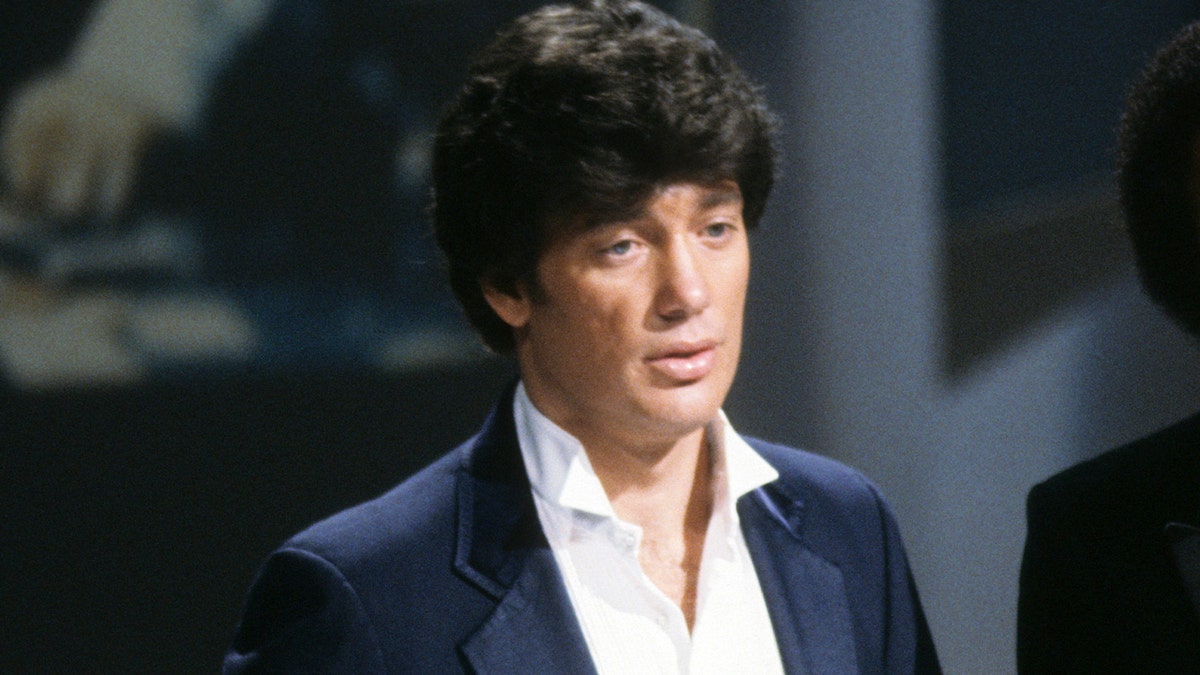 Ronnie McDowell wears a suit connected TV