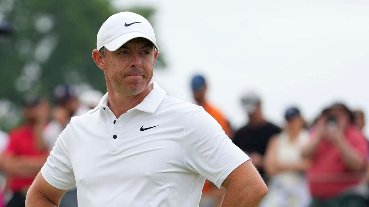 Rory McIlroy looks on