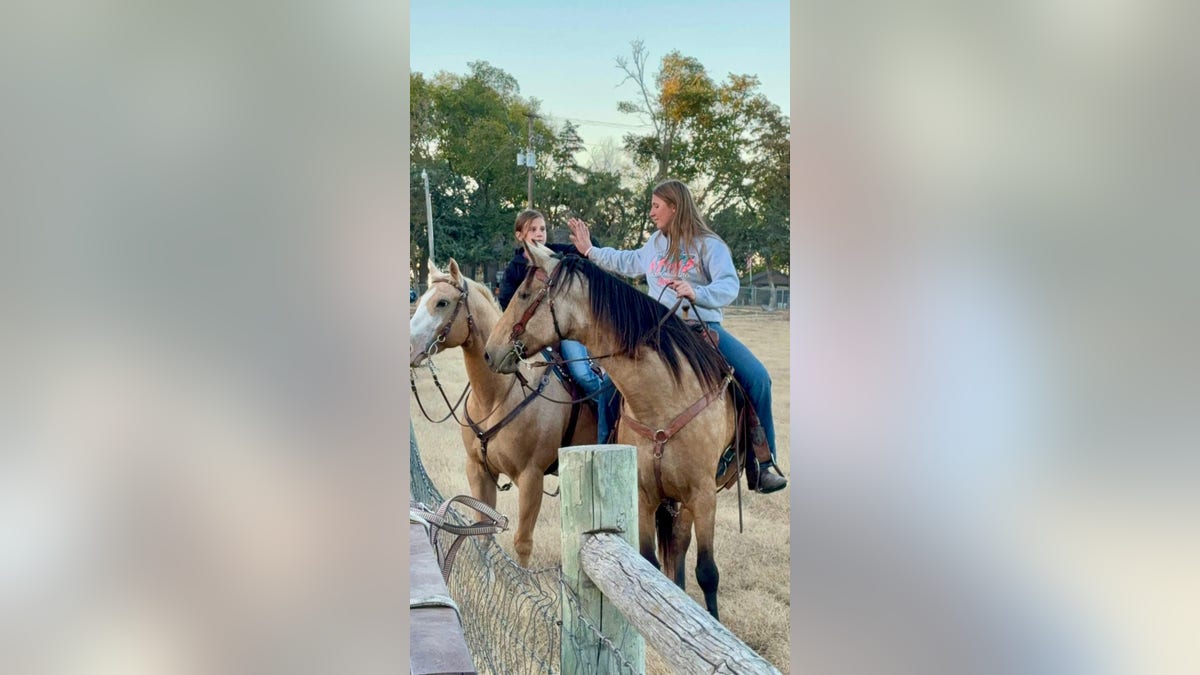 Saige and her sister ride horses