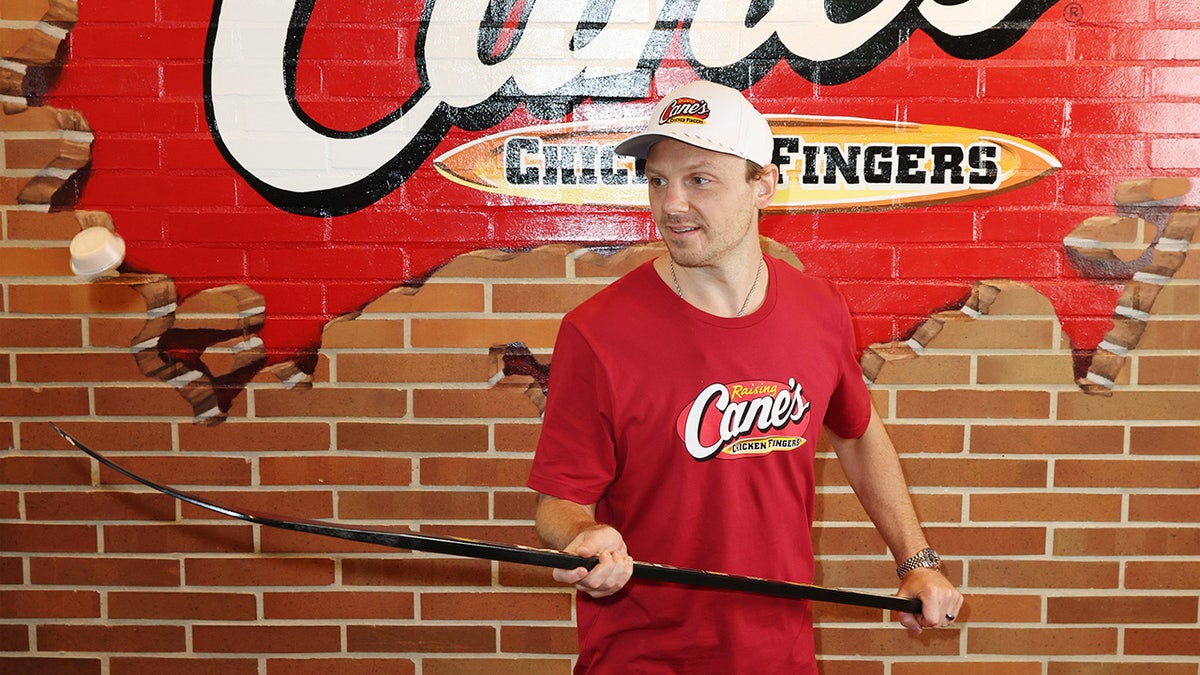 Sam Reinhart plays with puck at Raising Cane's