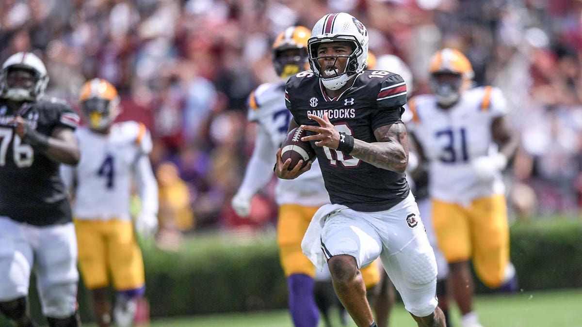 LaNorris Sellers runs with the football