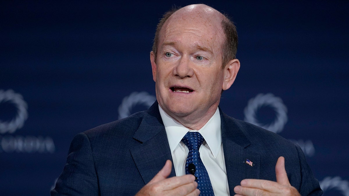 Sen. Chris Coons gesturing while speaking