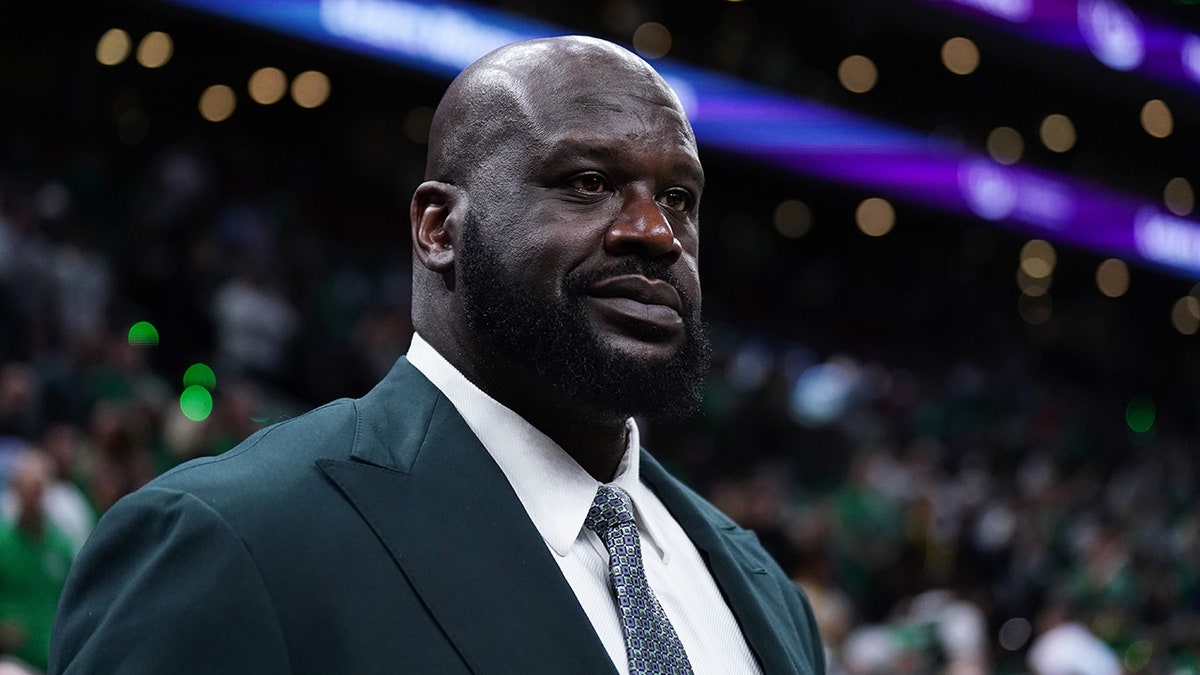 Shaquille O'Neal looks on