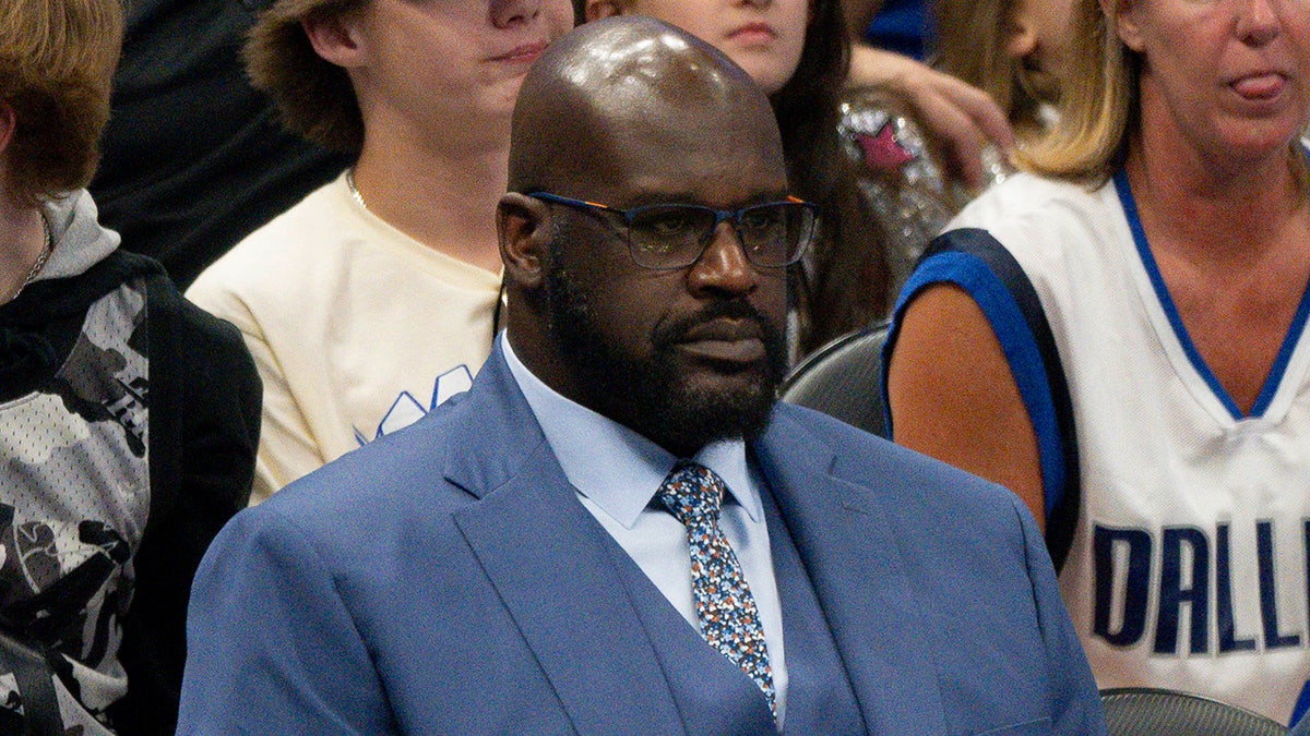 Shaquille O'Neal looks on