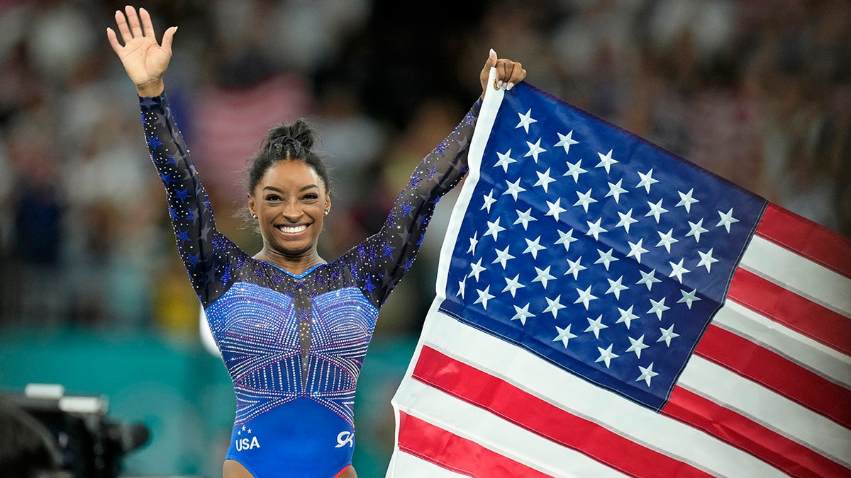 Simone Biles celebrates