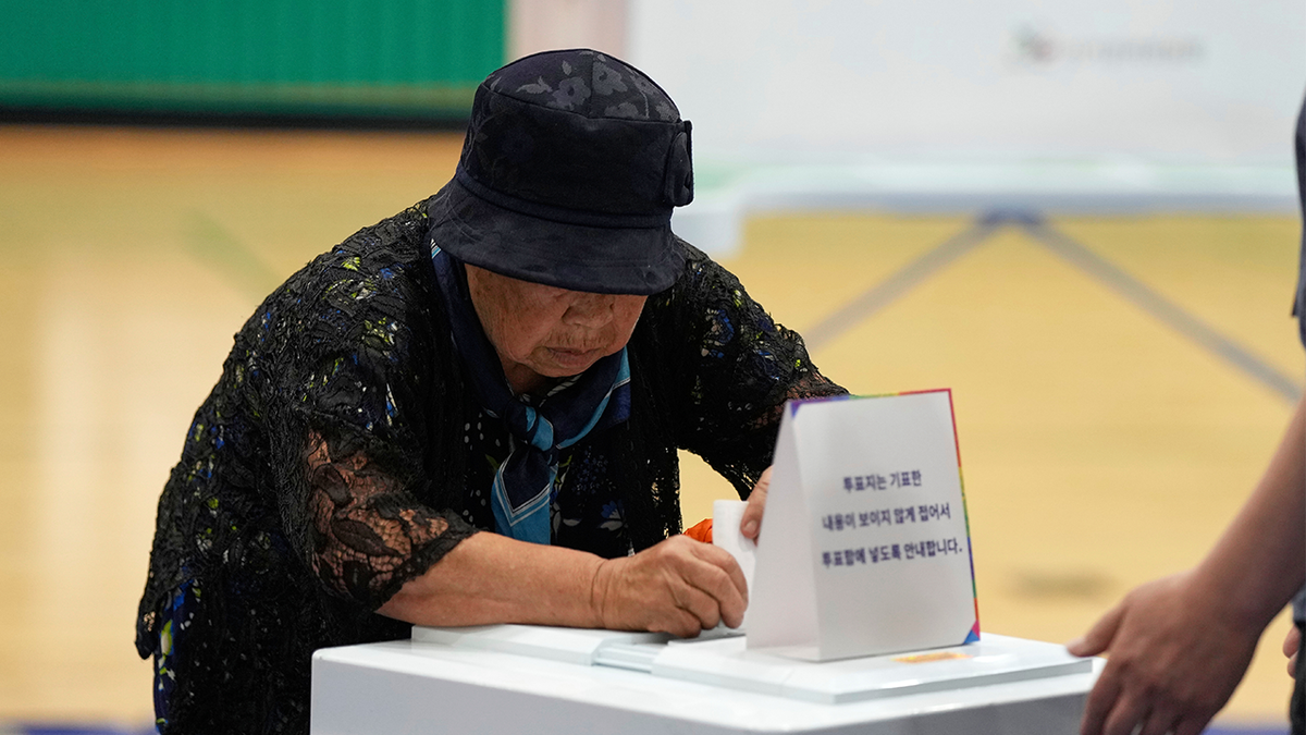 A woman casts her vote