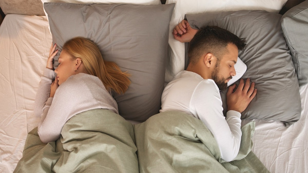 Sleeping back to back