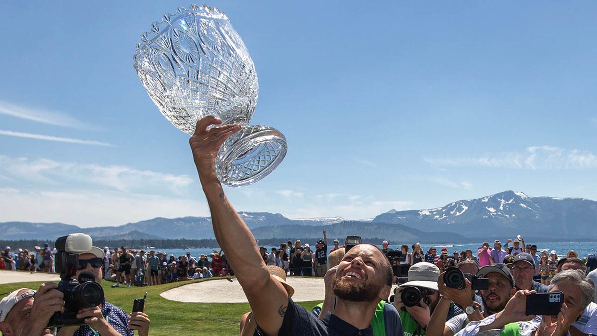 Stephen Curry with the trophy