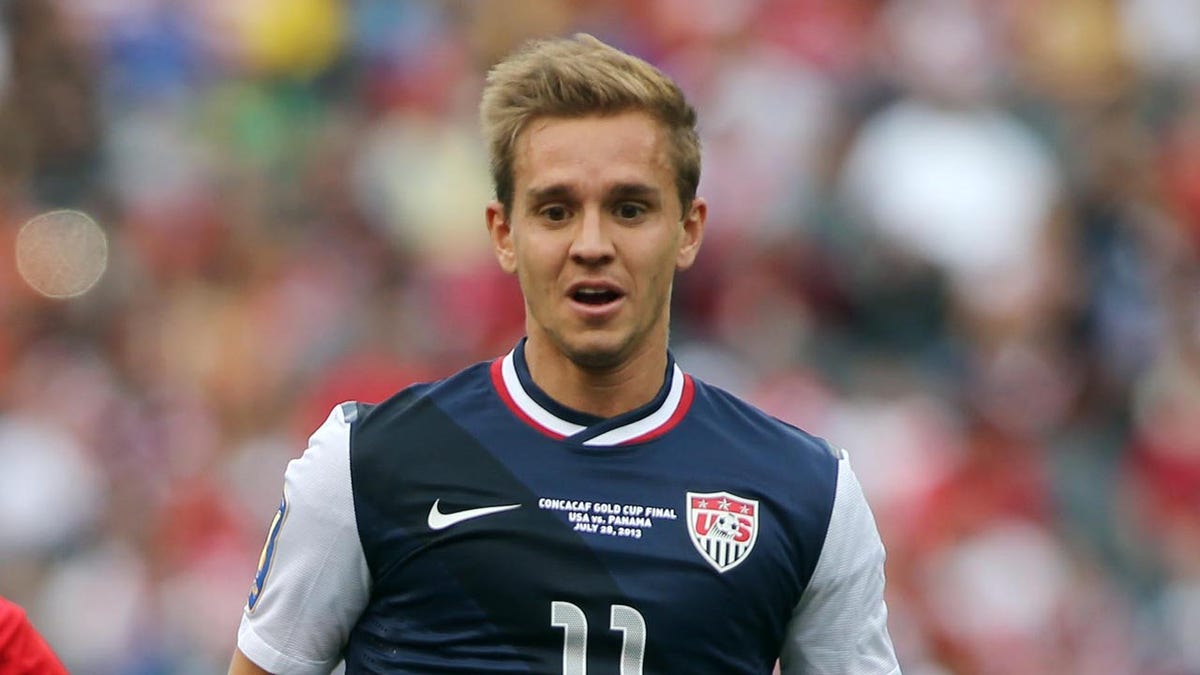 Stuart Holden looks on