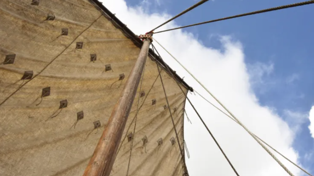 Wide shot of Viking ship sail