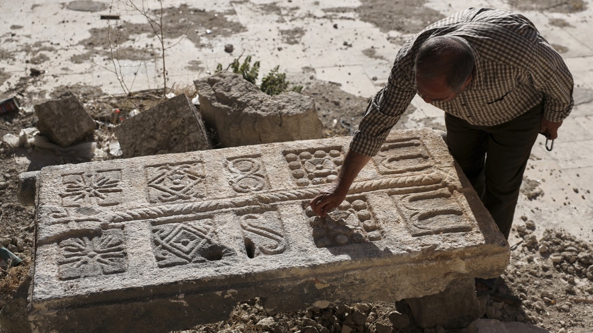 Man uncovering Byzantine tomb