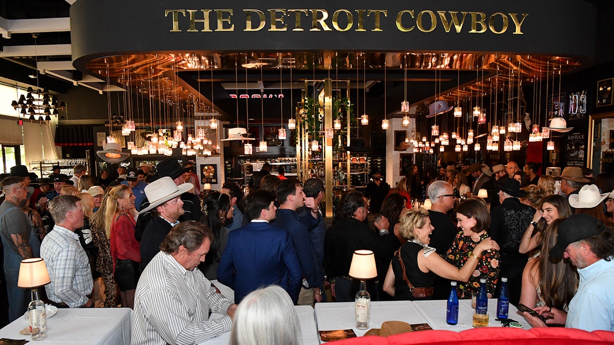 People gather inside Kid Rock's The Detroit Cowboy restaurant in Nashville.
