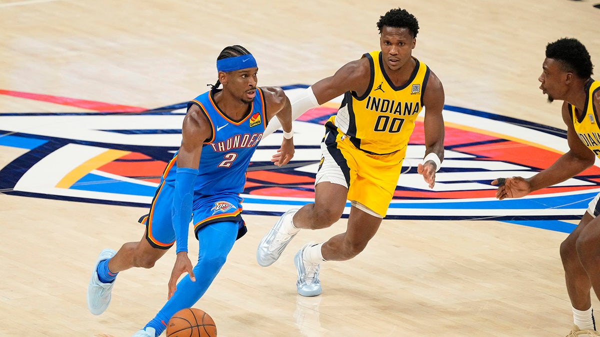 Shai Gilgeous-Alexander dribbles