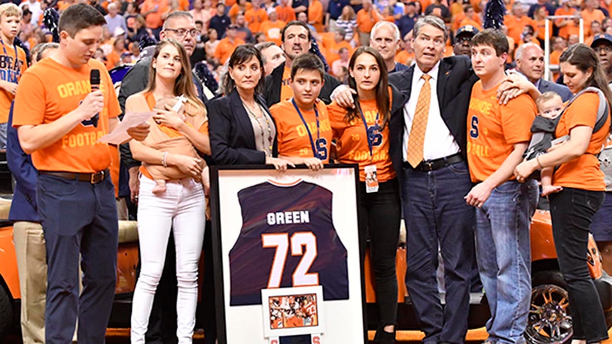Tim Green looks on with his family.