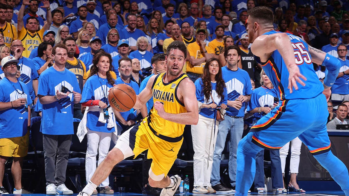 T.J. McConnell dribbles