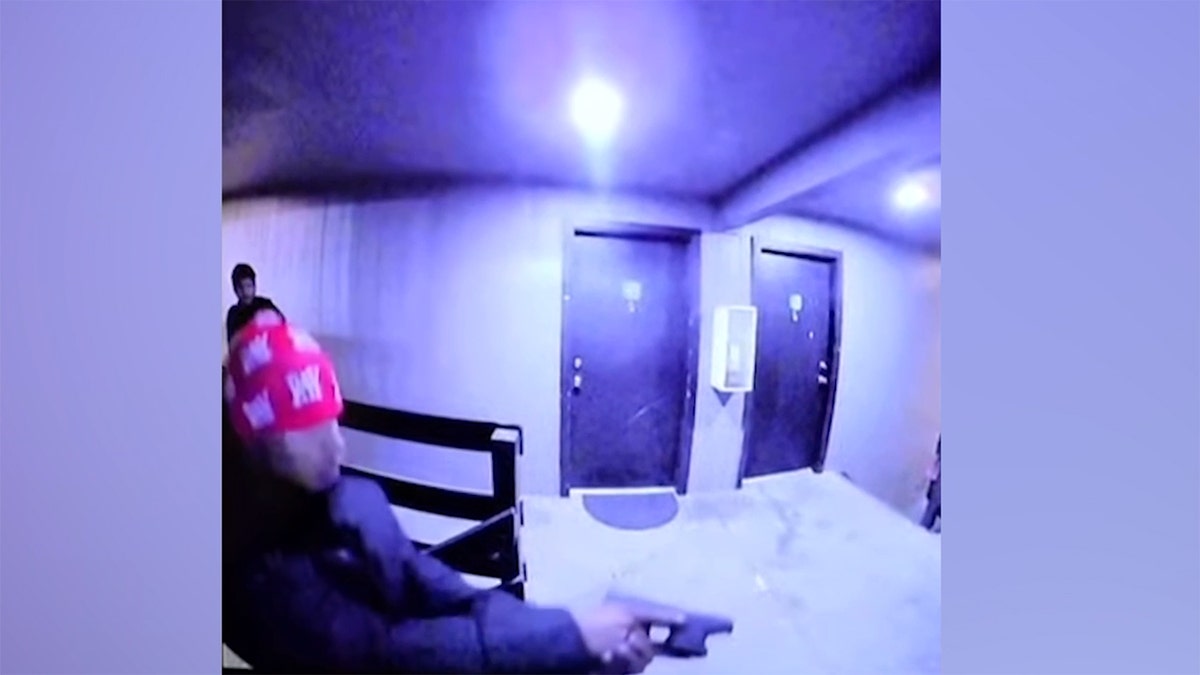 Armed man pointing a pistol