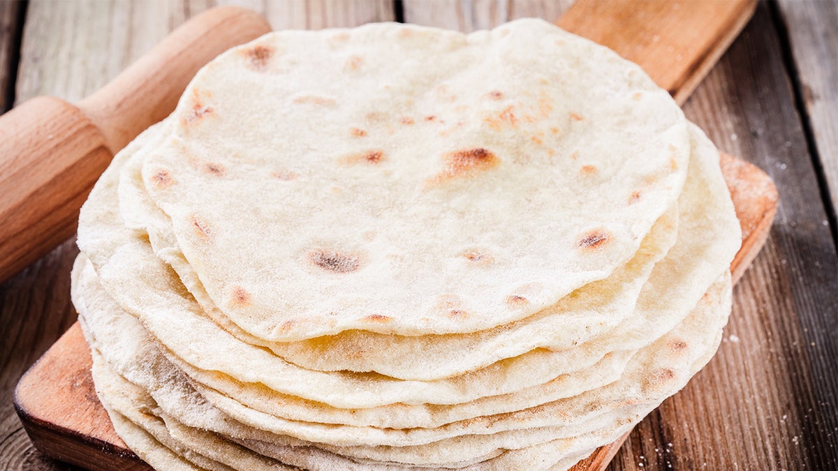 Stacked wheat tortillas on table