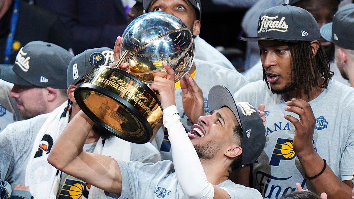 Tyrese Haliburton raises the trophy