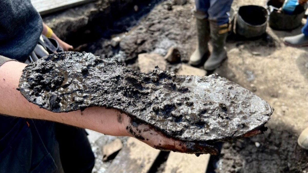 Second shoe covered in mud