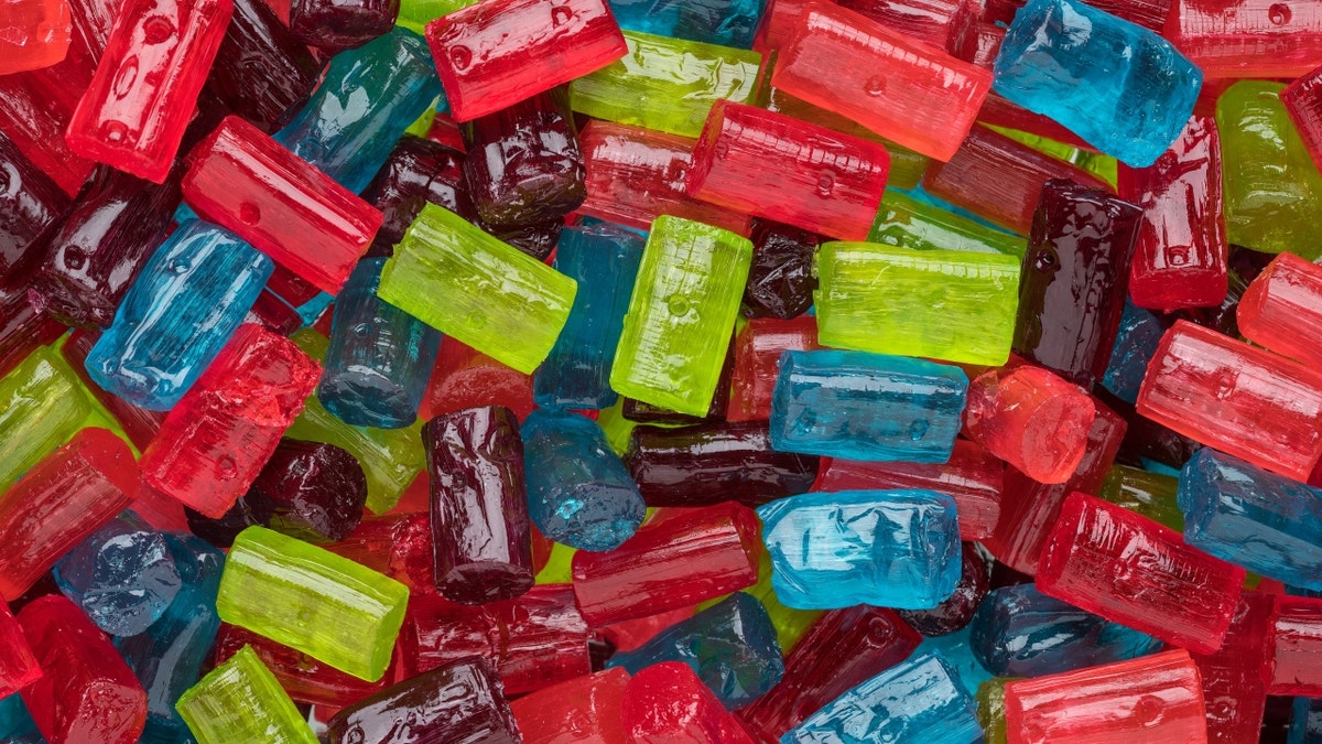 Unwrapped Jolly Ranchers candy piled on top of each other