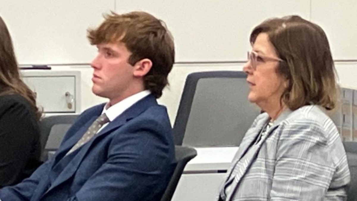 Kiernan Tague sits successful tribunal pinch his lawyer