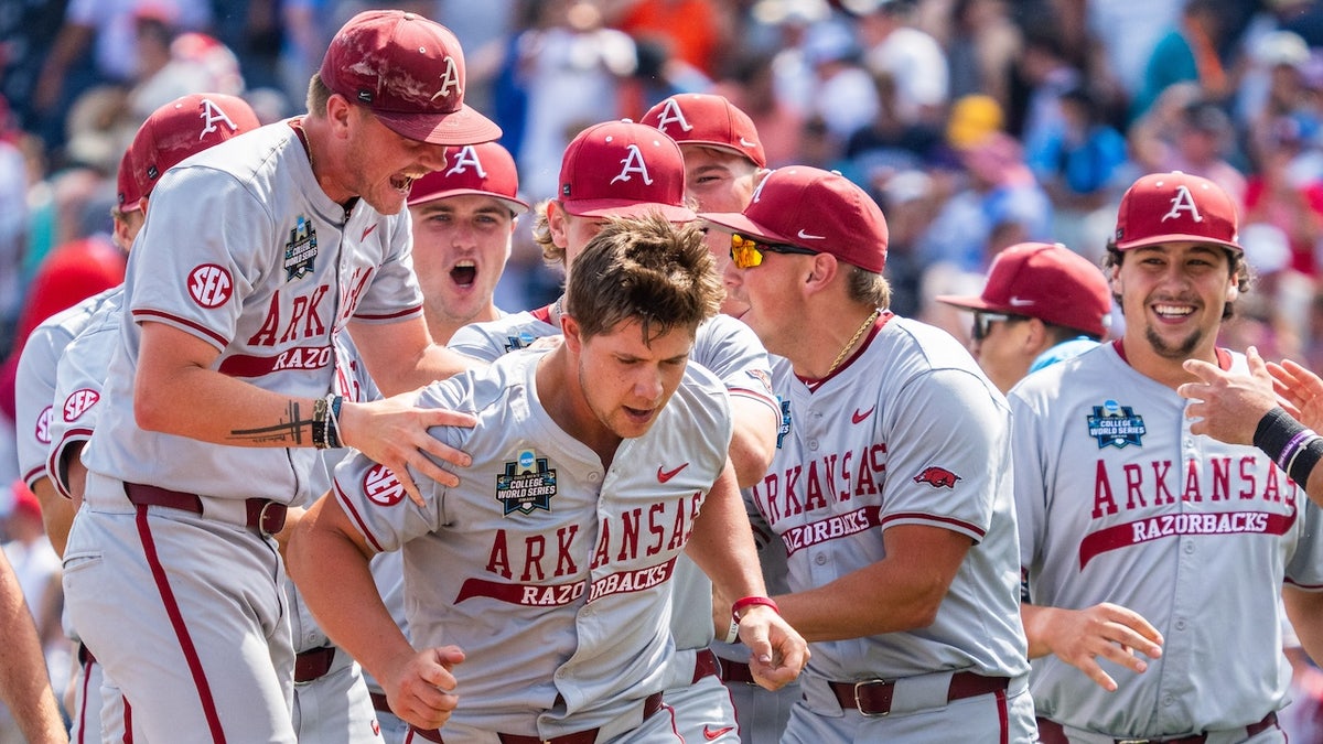 The Arkansas Razorbacks celebrate with starting pitcher Gage Wood (14) after pitching a no hitter to defeat the Murray State Racers at Charles Schwab Field. 