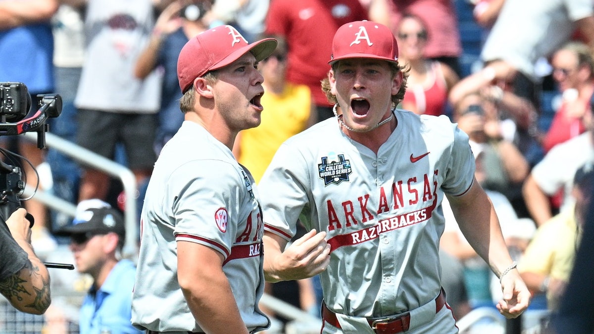 Arkansas Razorbacks starting pitcher Gage Wood (14) celebrates with infielder Gabe Fraser (6) after throwing a no hitter against the Murray State Racers at Charles Schwab Field. 