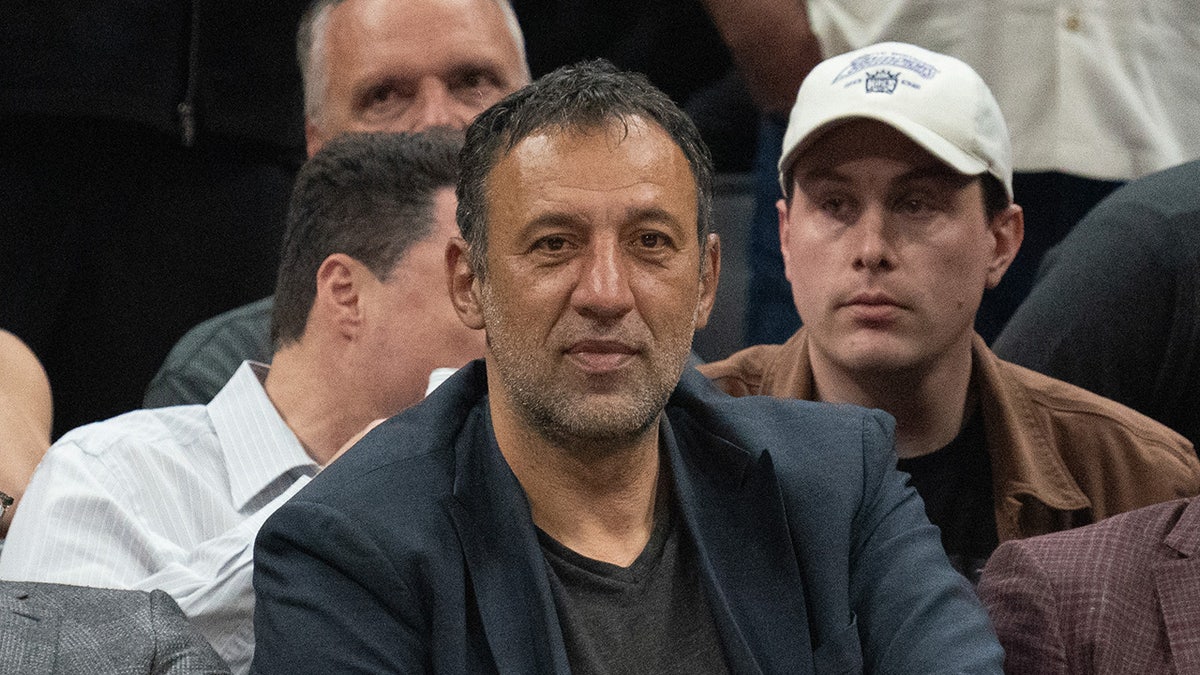Vlade Divac sits courtside