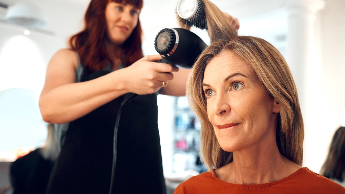 Woman at hairstylist