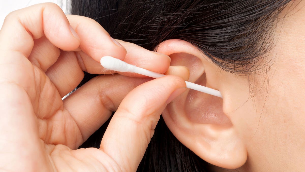Woman Q-tip ear wax