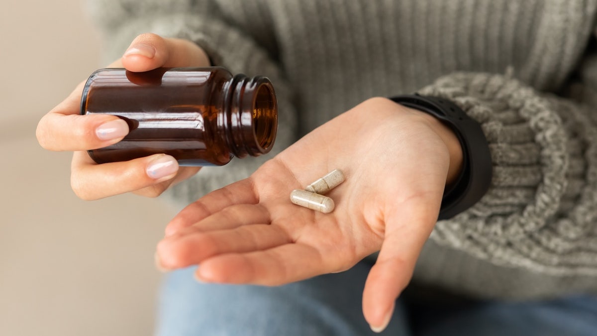 Woman taking supplements