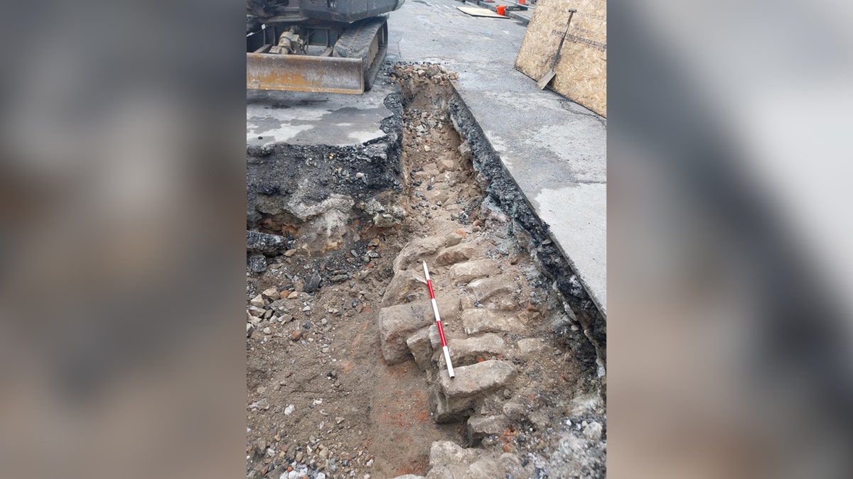 Horizontal photo of bricks beneath street